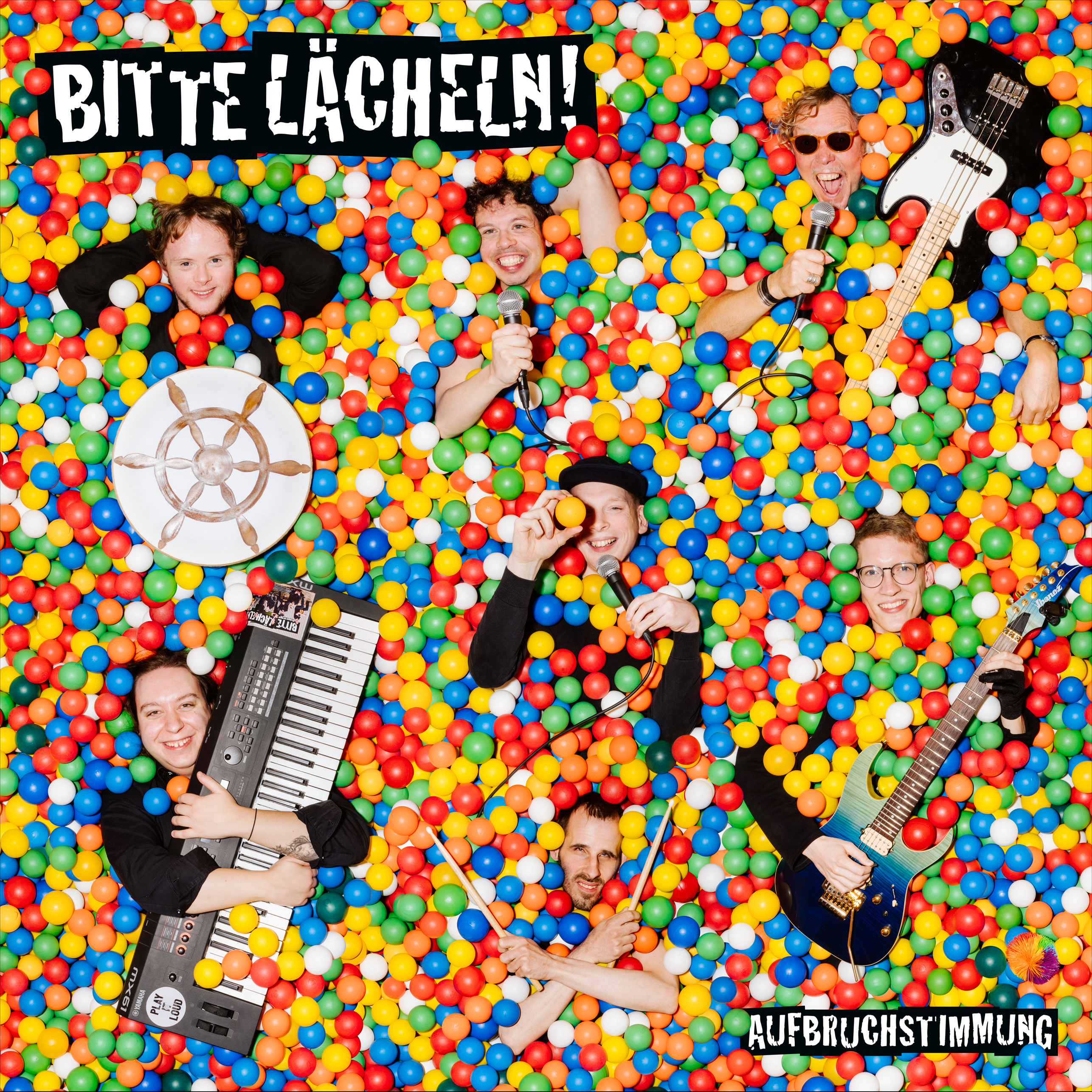 Bild von der Band Bitte Lächeln im Bällebad mit Instrumenten
